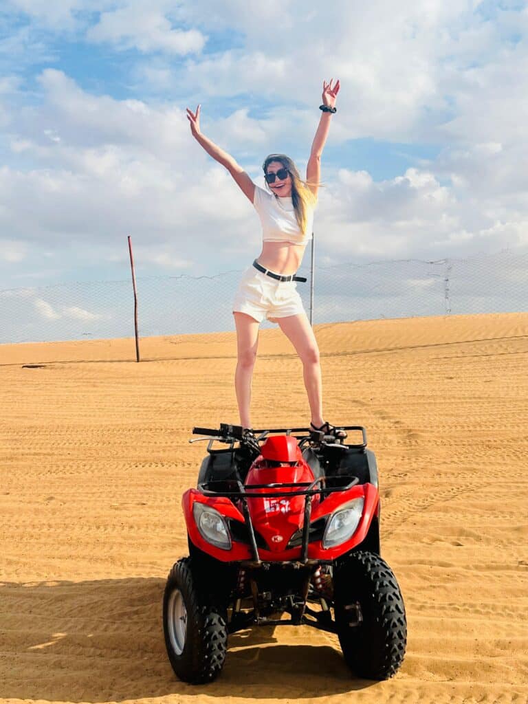 Travelers experiencing dune bashing in Dubai’s desert during a safari