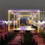 Bedouin camp in the desert with traditional tents and outdoor seating arrangements